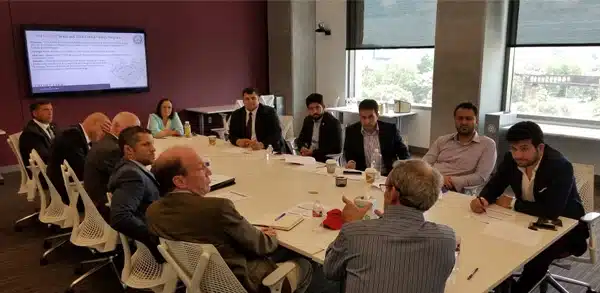 Team of professionals sitting at table together
